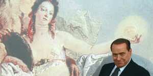 Italy's Prime Minister Silvio Berlusconi arrives at a news conference at Chigi Palace in Rome