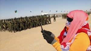 A Sahrawi woman takes a picture with her phone the day before during events in Tifariti. (Photo by Reuters)