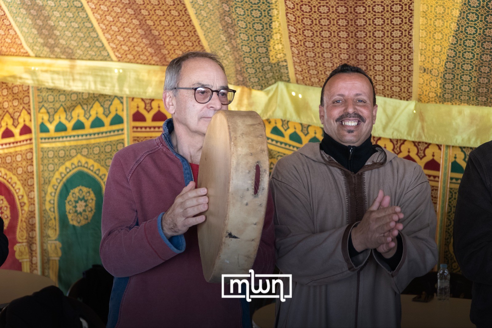 British ambassador to Morocco Simon Martin playing traditional instruments during the launch ceremony